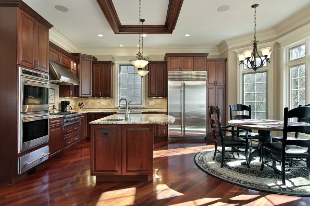 luxury kitchen with cherry wood cabinetry and eating area